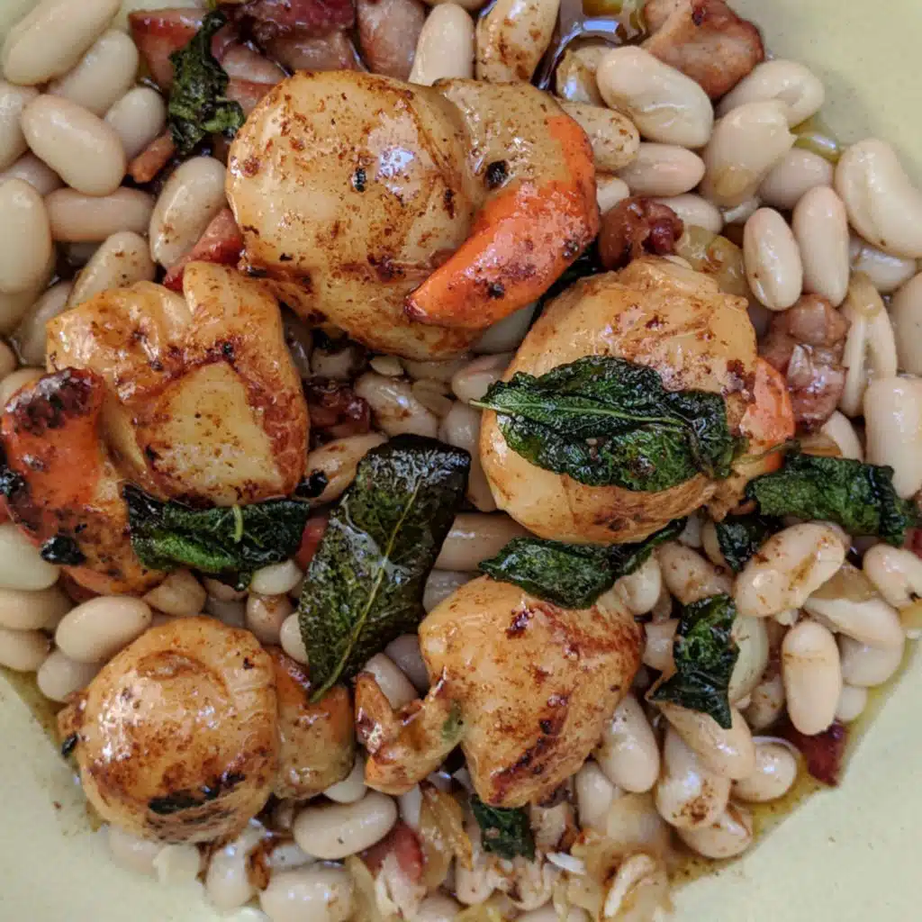 Sage brown buttered scallops with cannellini beans