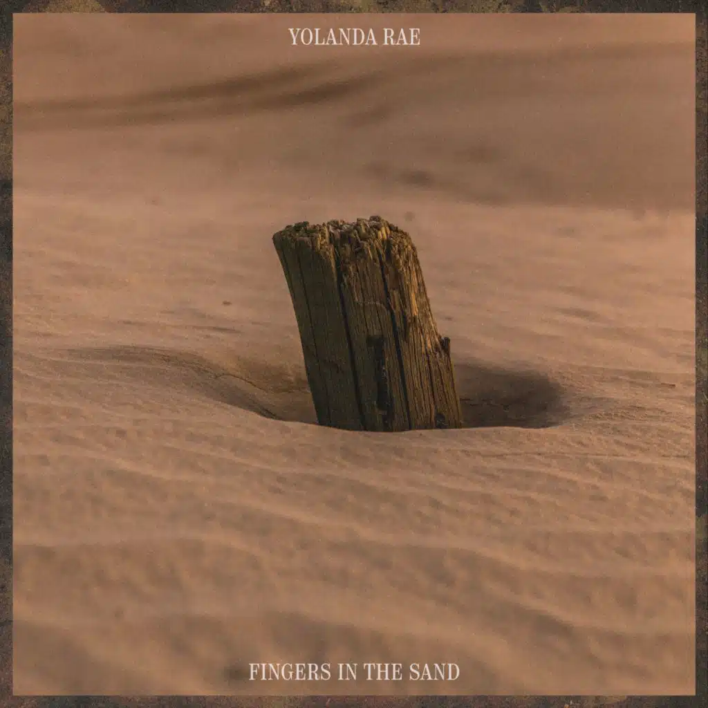Fingers in the sand