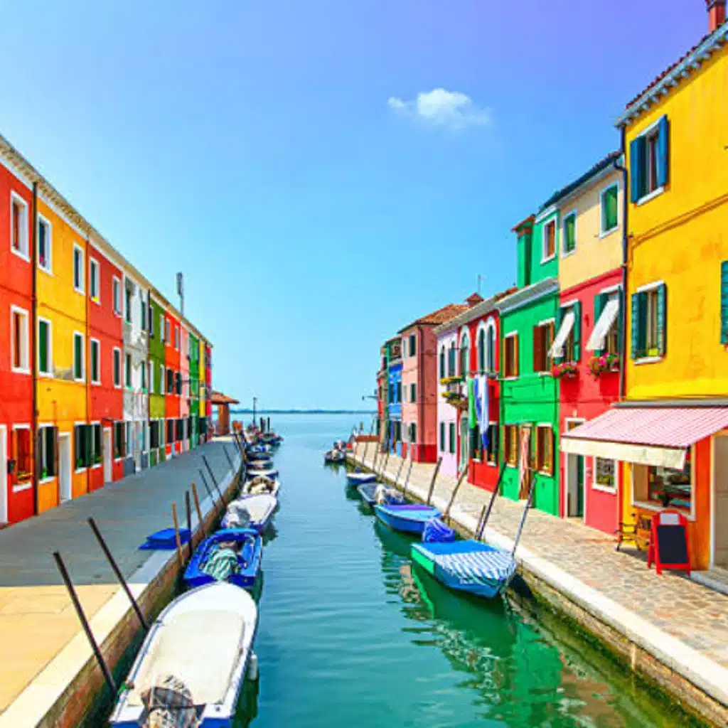 Small Island in Italy has brightly colored houses as required by LAW!!