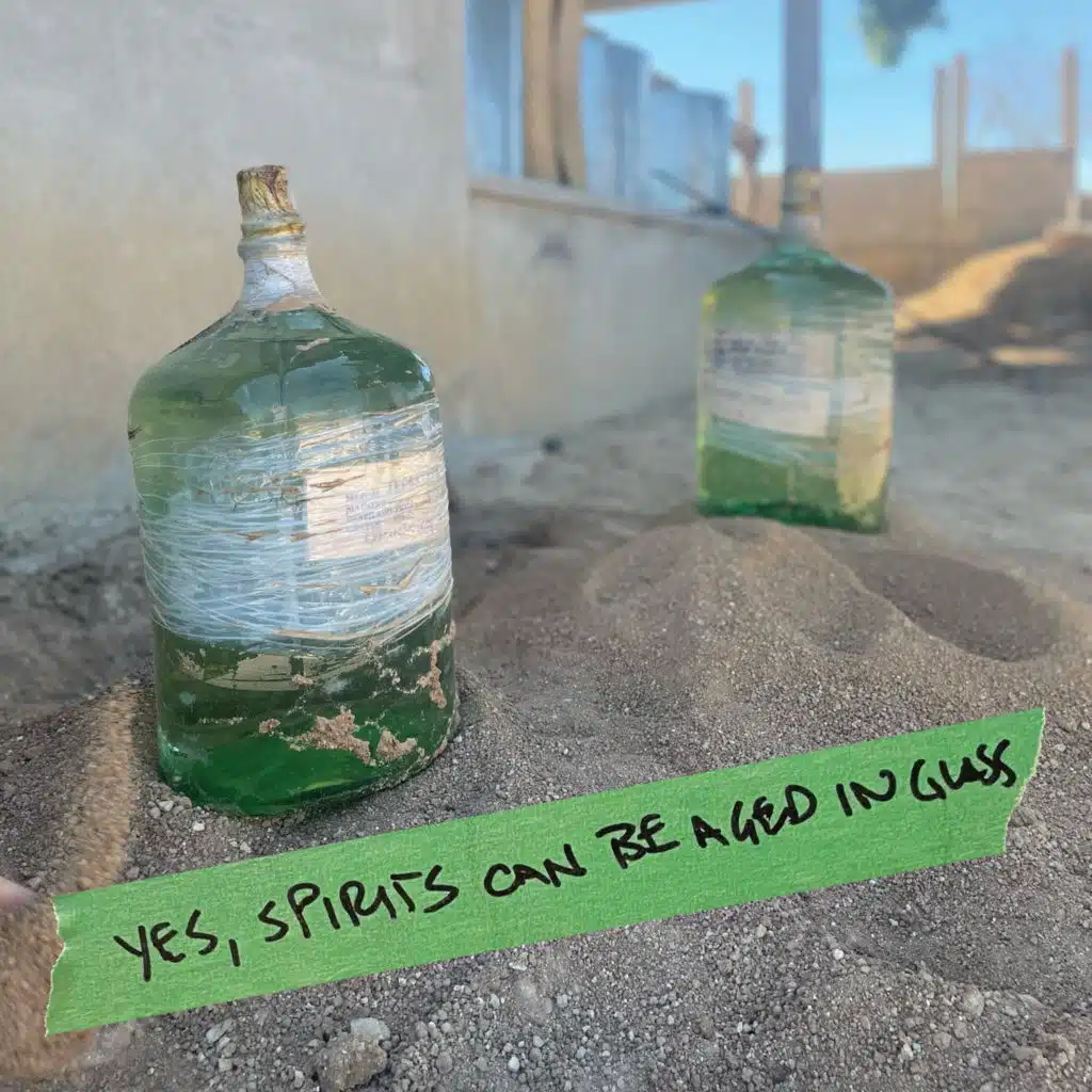 Yes, spirits can be aged in glass